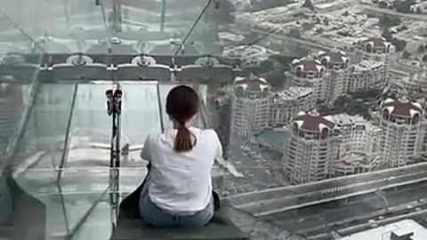 Attempting the world's scariest glass slide!