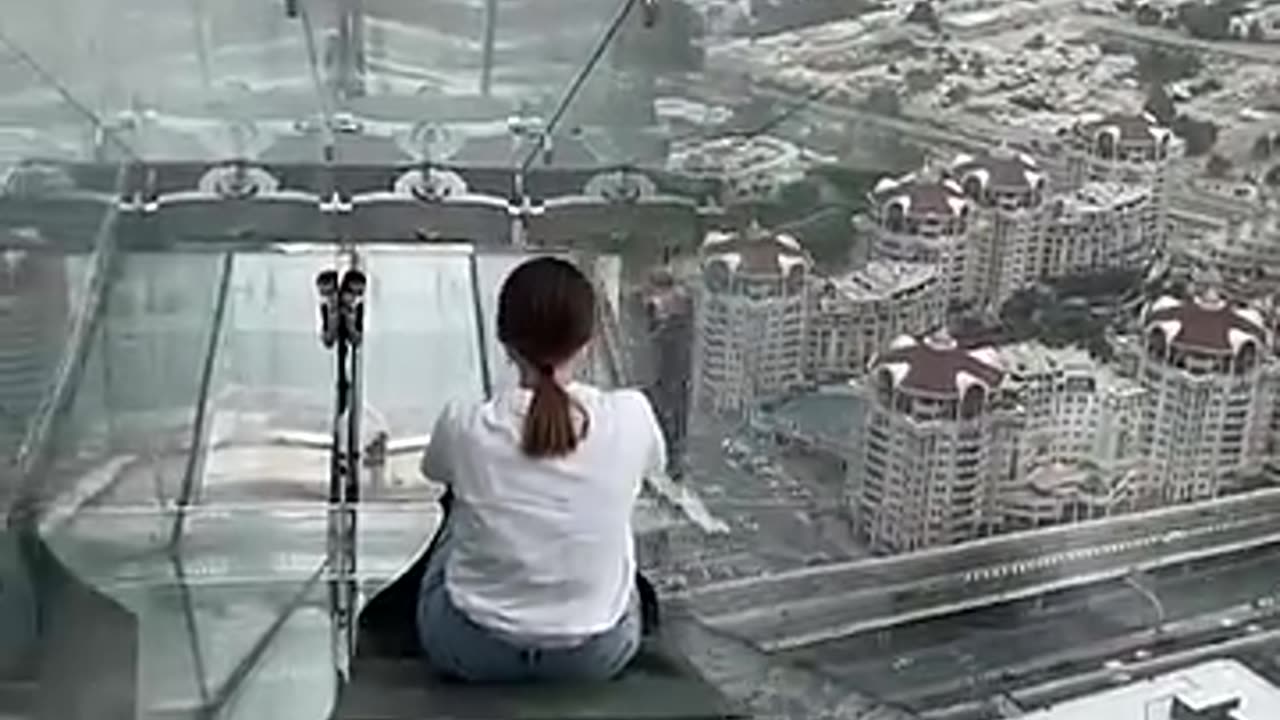 Attempting the world's scariest glass slide!