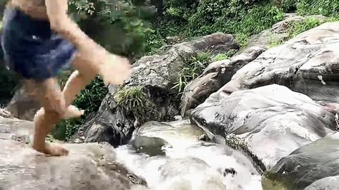 Tourist's Waterfall Adventure Turns Dangerous! 😨🌊