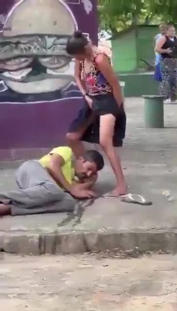 Woman pees on homeless man's face in public in Brazil Urban Park