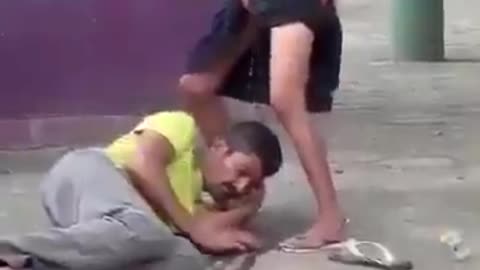 Woman pees on homeless man's face in public in Brazil Urban Park