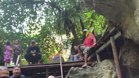 Swimming into the Forbidden Water Cave at Tham Chang Cave System in Vang Vieng, Laos