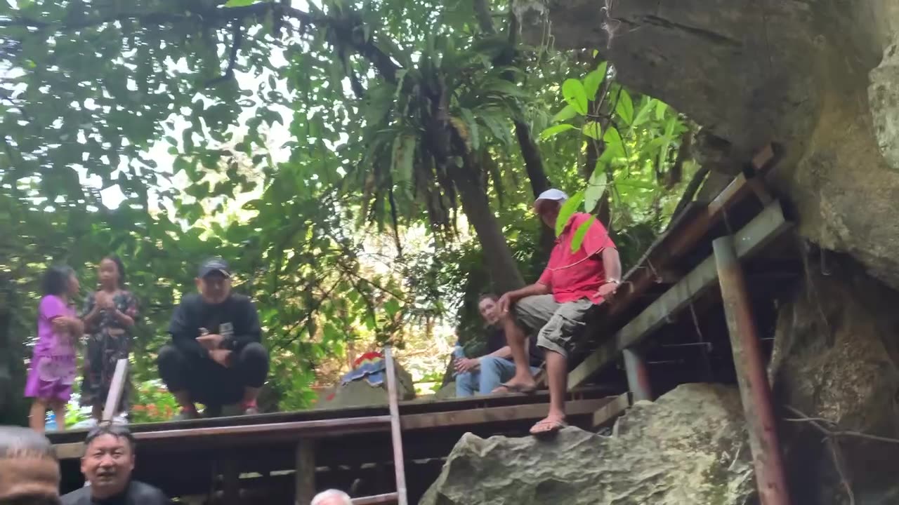 Swimming into the Forbidden Water Cave at Tham Chang Cave System in Vang Vieng, Laos
