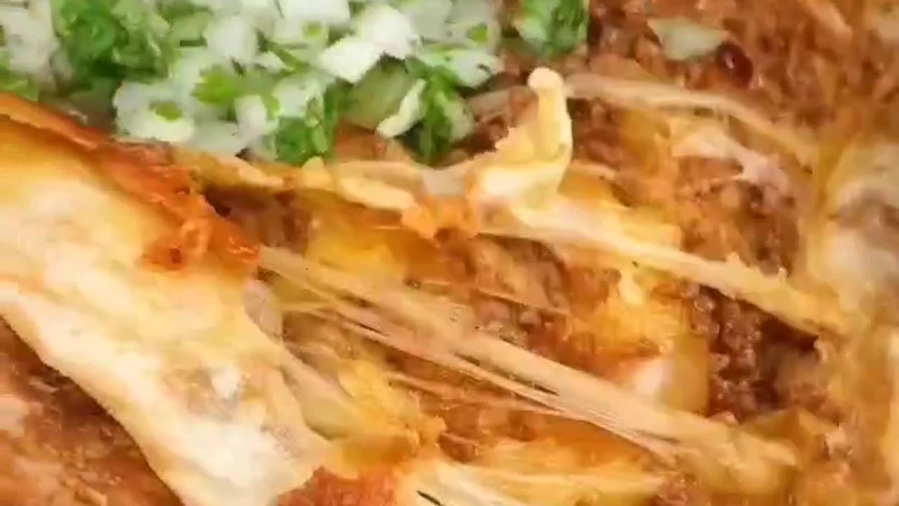Tortilla filled with beef and paper and mozzarella cheese