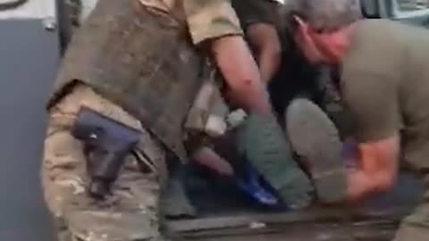 Russian Welcoming Committee Argues Over Who's Keeping Fallen Soldiers Watch