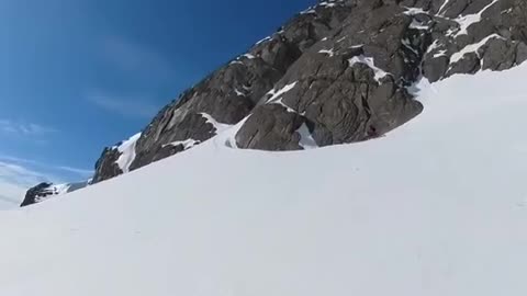 Motorbike rider nearly gets taken out by a mini avalanche