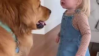 Little Girl gets on to her dog for eating her snack