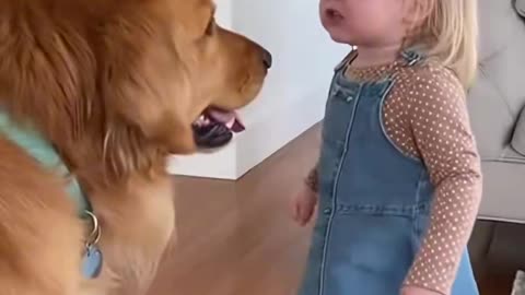 Little Girl gets on to her dog for eating her snack