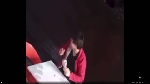 As a gunfight happens, He laughed and continued eating his ice cream.