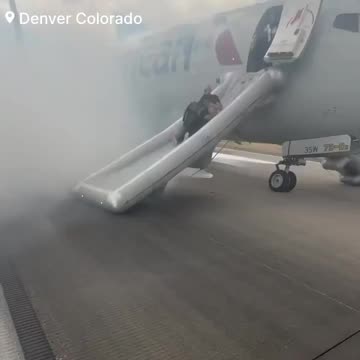 People in Denver Evacuate From an American Airlines Jet After Wheels Caught Fire
