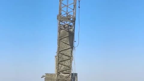 Crane Lifting Heavy Object in Mud