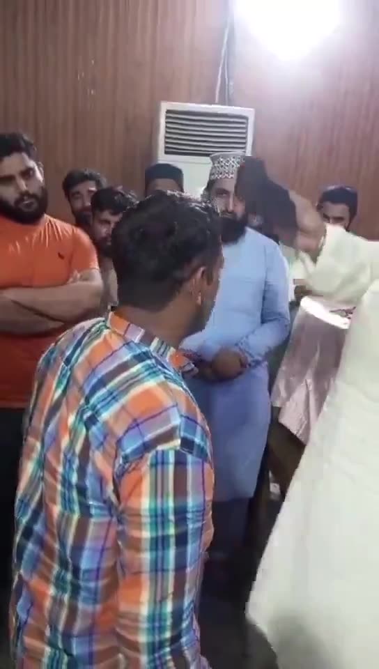 Pakistani doctor treats patients with a beach slipper.