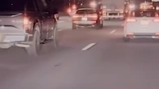 Dashcam footage shows a truck plunging off an overpass onto a freeway in Rialto, California;