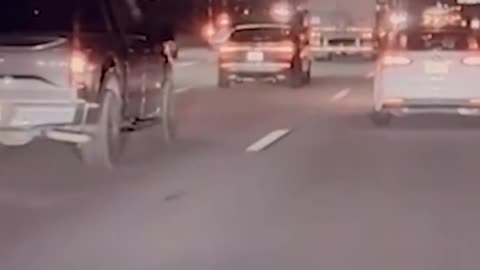 Dashcam footage shows a truck plunging off an overpass onto a freeway in Rialto, California;