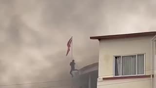 In Nepal, citizens storm Communist Party headquarters and tear down hammer and sickle flag.