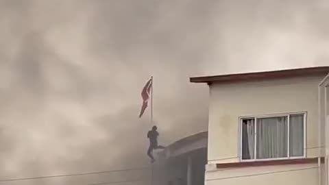In Nepal, citizens storm Communist Party headquarters and tear down hammer and sickle flag.