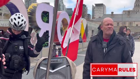 Canadian police turn off a speaker that was playing the Canadian national anthem