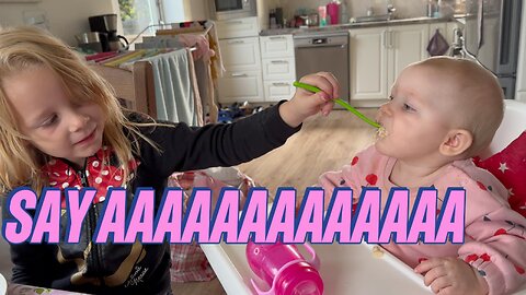 adorable baby feeding – big sister says “say aaaaaa” and kayla opens wide 🥄