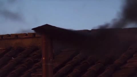 Black smoke rises from the Vatican indicating no new pope has been selected