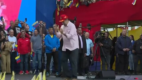 Maduro is dancing onstage at a public rally amid ongoing