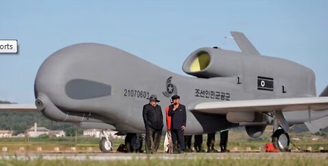 North Korean state media show leader Kim with drones