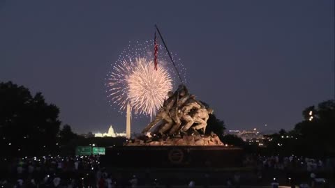 Fireworks light up the night sky over the nation’s capital, casting FOR DAD & HIS BROTHERS SEMPER FI