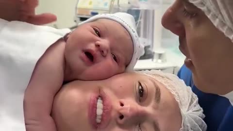 A Miracle of Love: The Newborn Baby Video That Smiles at His Father's Voice Moves the World