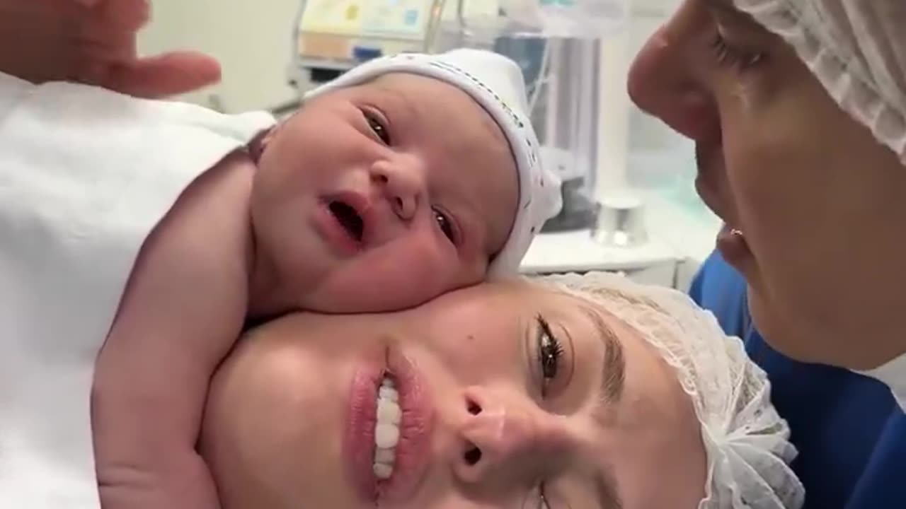 A Miracle of Love: The Newborn Baby Video That Smiles at His Father's Voice Moves the World