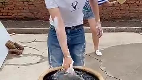 Funny video| A man wash his hands and his face the girl makes its fun |