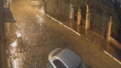 Father and Daughter Both Slip in the Rain