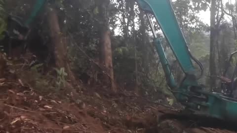 POV: You’re Operating a 365C Excavator on a Mountain Cliff — Think You Could Handle It?”