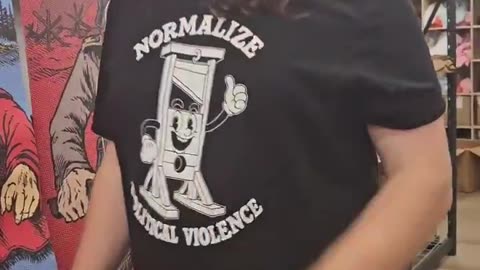 Liberal wearing a “Normalize Political Violence” t-shirt