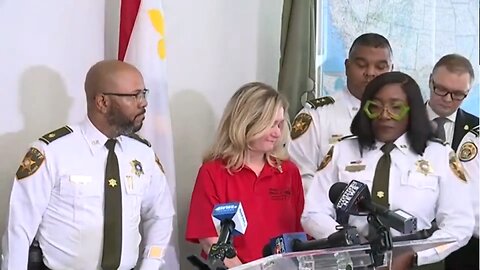 Stephanie Minto-Gibson wears bizarre glasses to a press conference