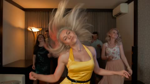 Young people dancing fun, and a blonde girl in a yellow.