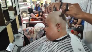 Beautiful women Long to Headshave at barbershop