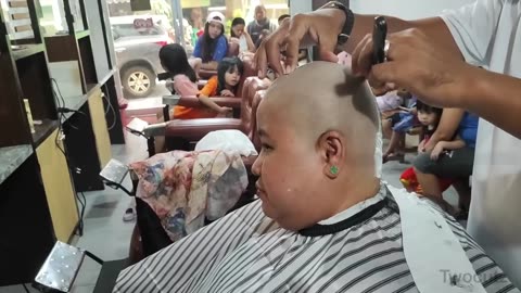 Beautiful women Long to Headshave at barbershop