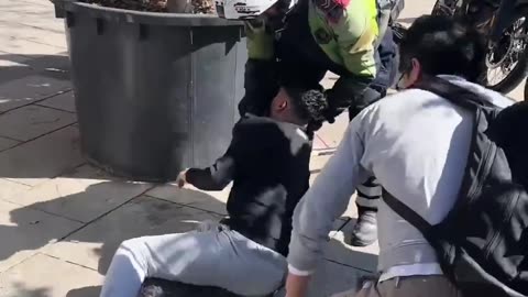 Photographer had his camera stolen. He chased down the thief and put him into a rear choke