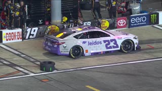 NasCar - This is pure sportsmanship. Pit crew 19 stepping in to help team 23 after tire falls off