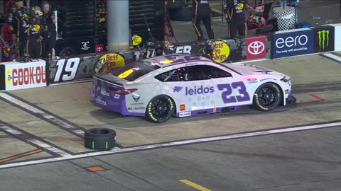 NasCar - This is pure sportsmanship. Pit crew 19 stepping in to help team 23 after tire falls off