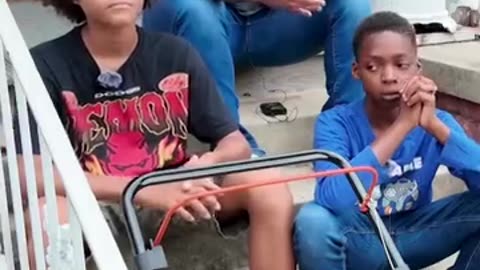Kaleeal Lee, 13, and Antoneio Reid, 11, are lawn care business in Petersburg, Virginia.