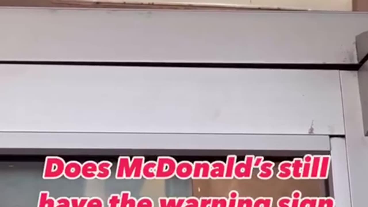 Why are McDonald's restaurants putting up signs warning customers?