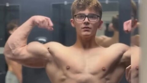 Handsome muscular man showing off his muscles