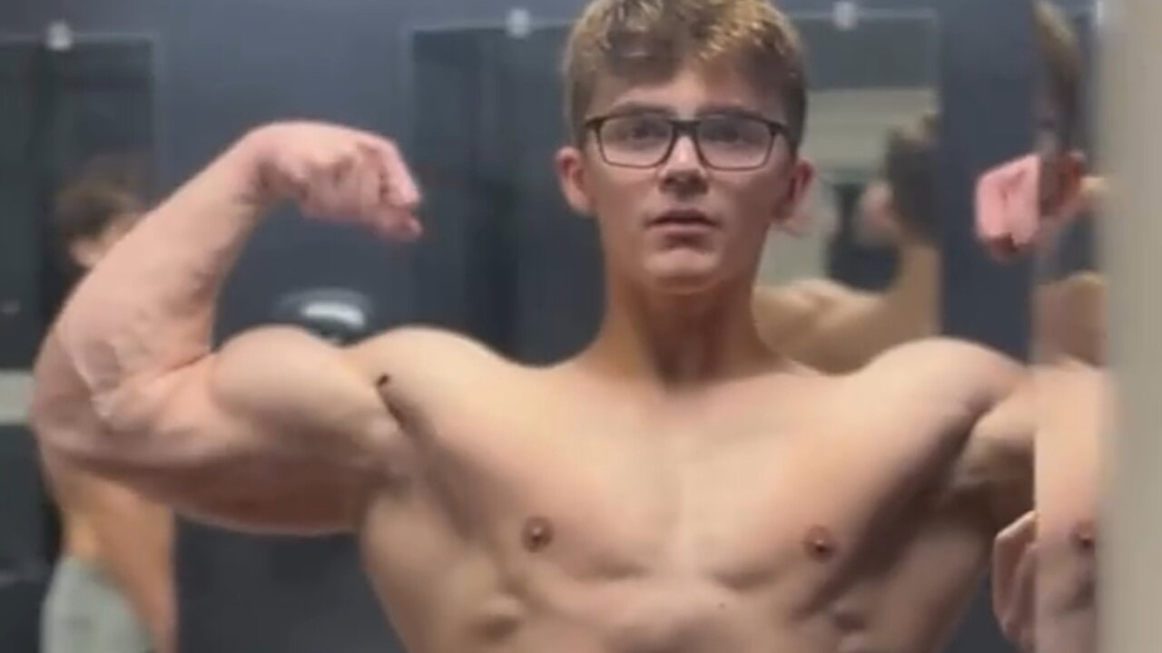 Handsome muscular man showing off his muscles