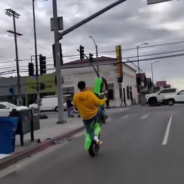 Motorcyclist ran a red light in wrong lane while doing a wheelie then hit. Instant Karma