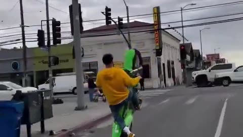 Motorcyclist ran a red light in wrong lane while doing a wheelie then hit. Instant Karma