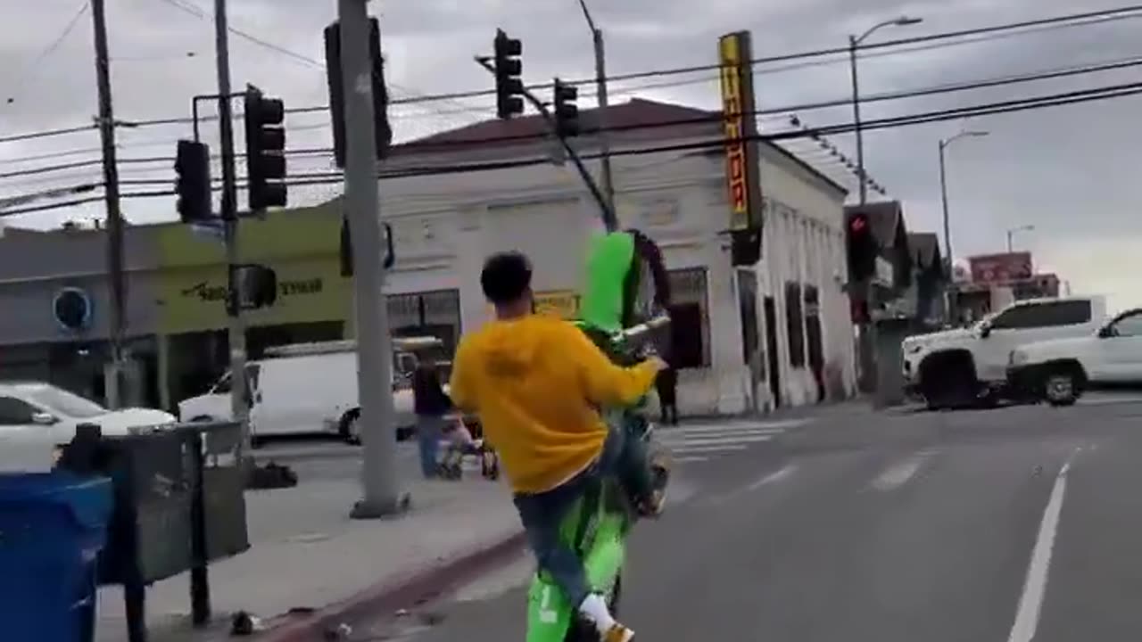 Motorcyclist ran a red light in wrong lane while doing a wheelie then hit. Instant Karma