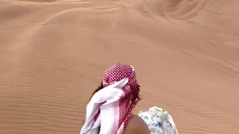 Snowboard Sliding Down Desert Sand Dune