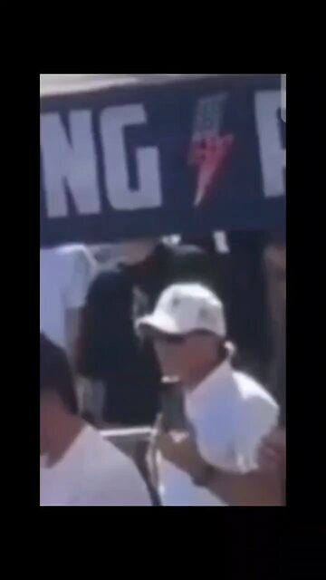 Is This Charlie’s Security Detail Standing Behind Him Making These Signs & Gestures?