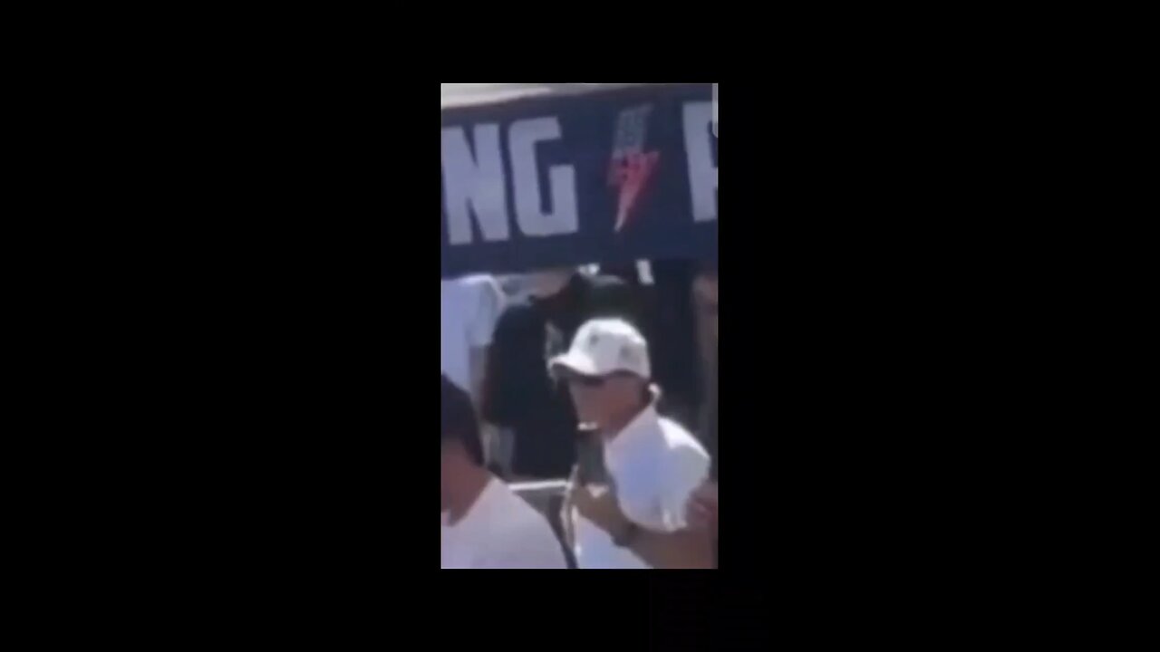 Is This Charlie’s Security Detail Standing Behind Him Making These Signs & Gestures?