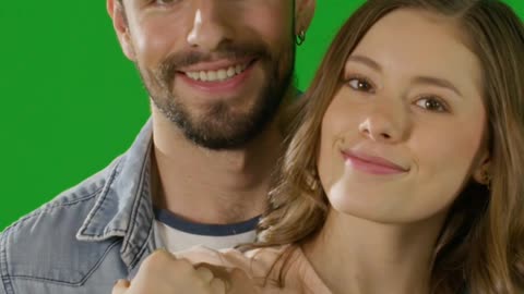 Happy couple posing with green background